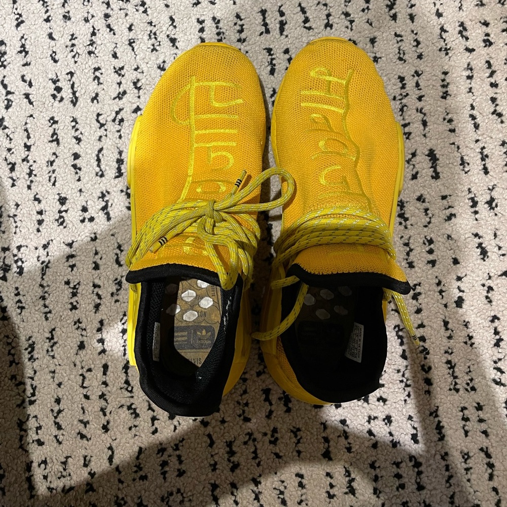 Pair is Adidas Human Race sneakers